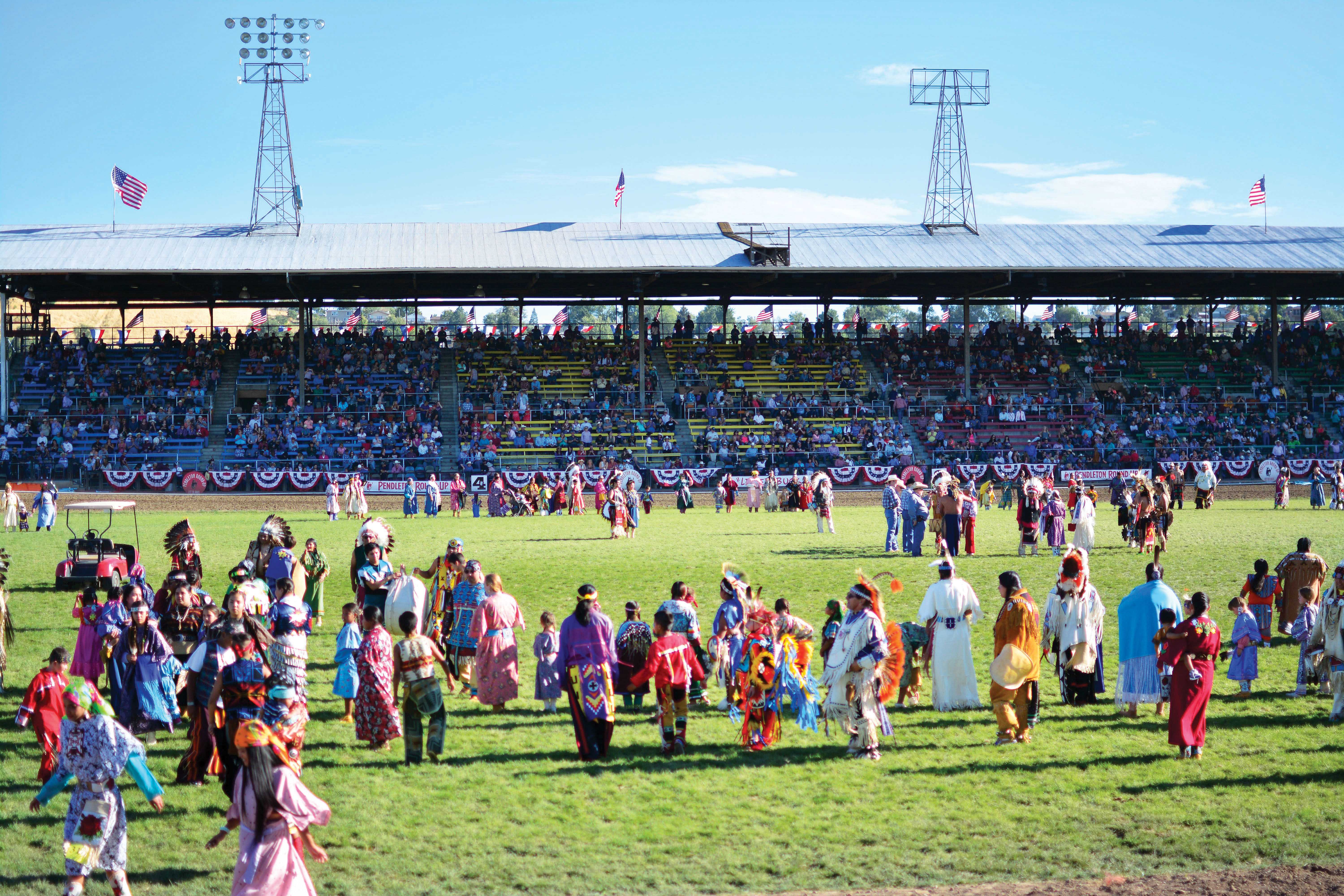 A drumbeat guides the dancers as they circle the arena.