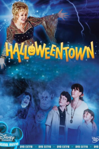 Blue fog illuminating three children and a witch. "Halloweentown" in spooky yellow lettering.