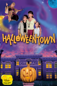 "Haloweentown" in orange lettering in front of a stone building and an ominous purple sunset.