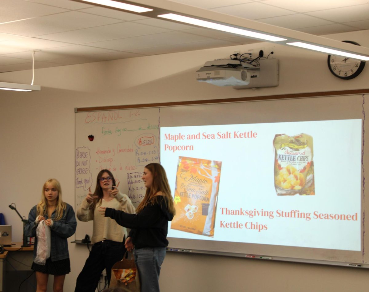 Calista Lattal, Hadley Youngers and Olive Raak are kicking off the first-ever meeting for the Trader Joe's Club.