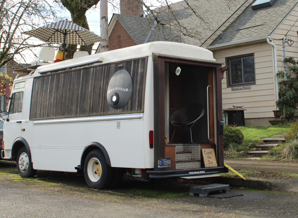 The camper-van-turned-Happiness-Exhibit is located on NE 23rd and Going St.